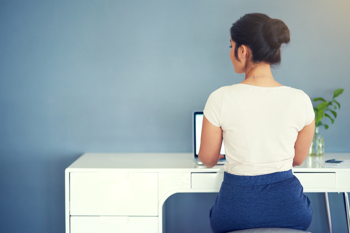 Woman with good posture sitting at desk