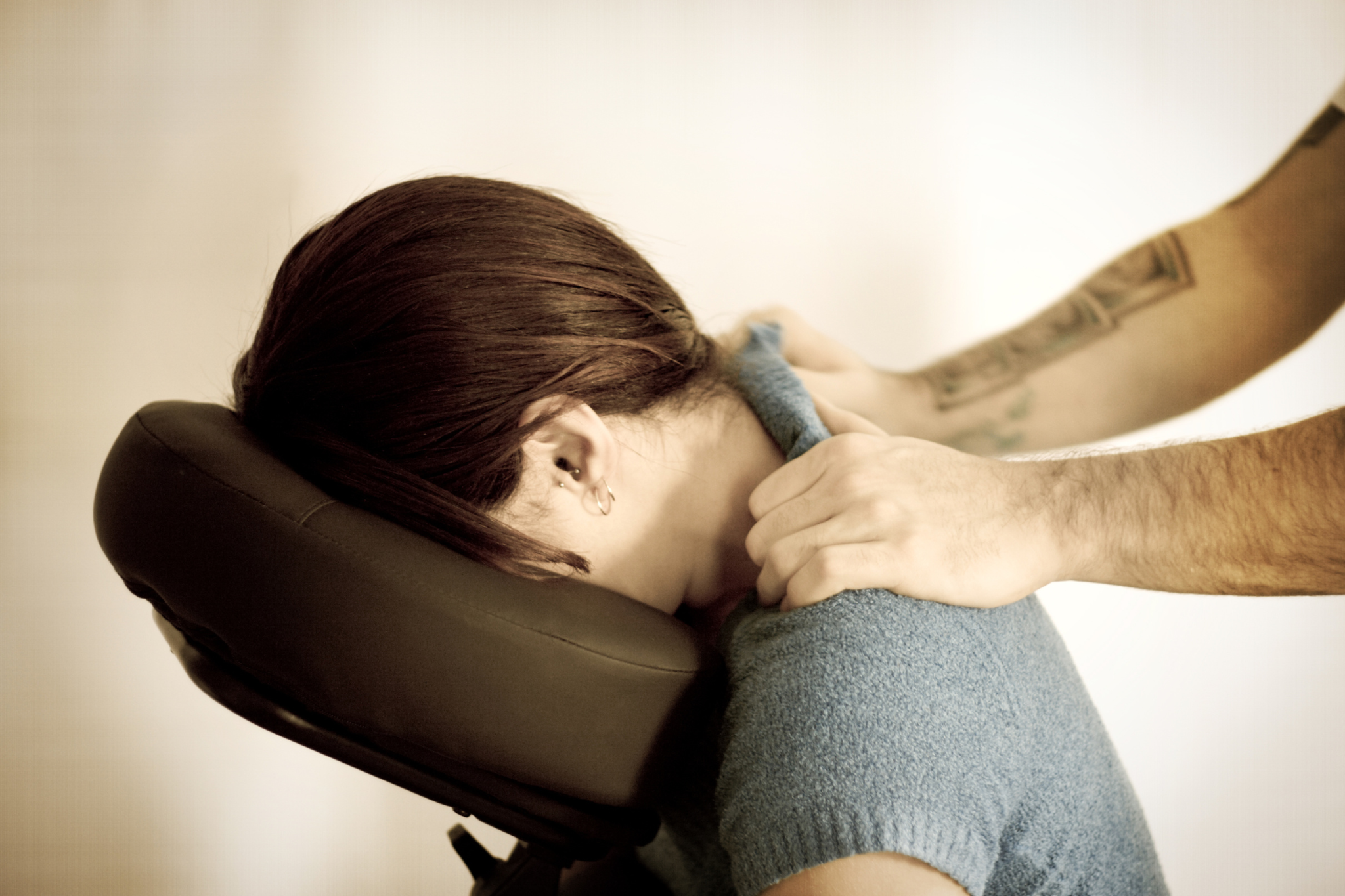 woman receiving seated massage therapy