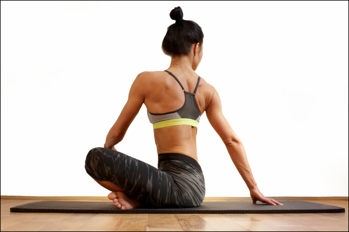 Woman with strong back and perfect posture stretching