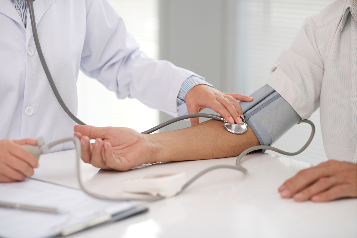 Man having blood pressure taken during check-up