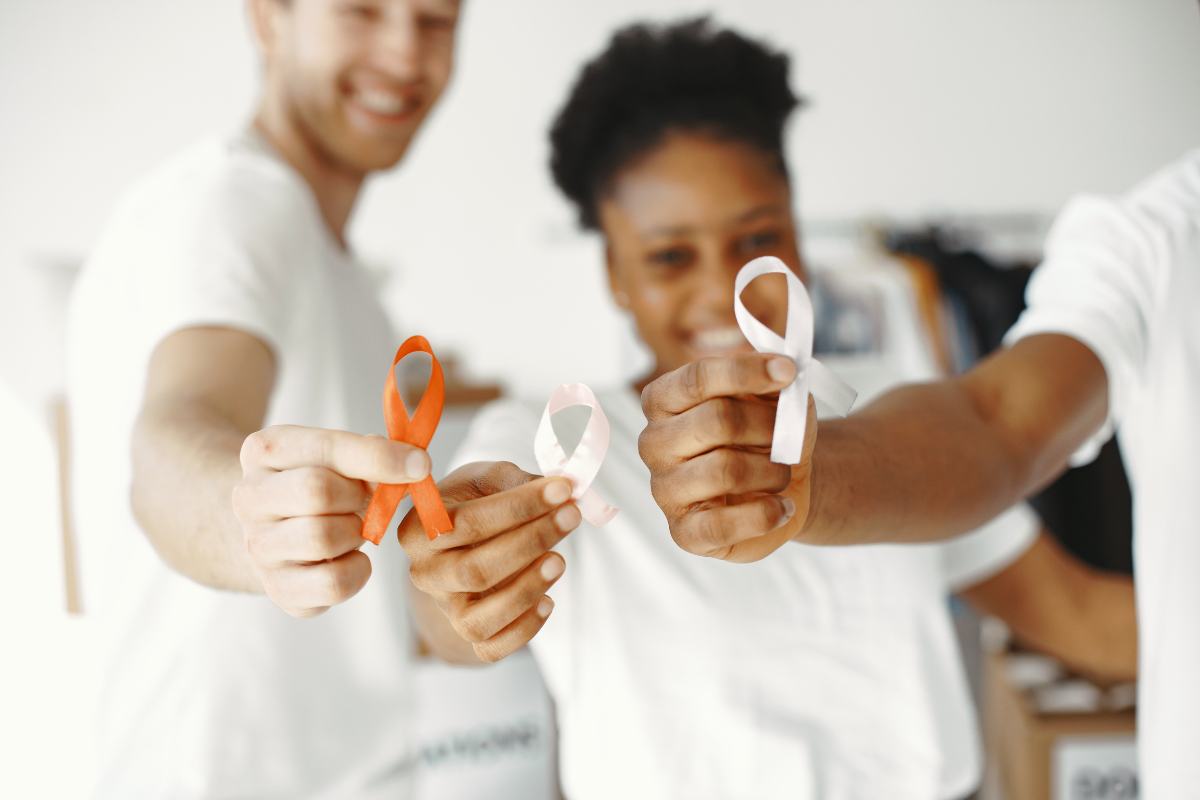 People holding cancer awareness ribbons