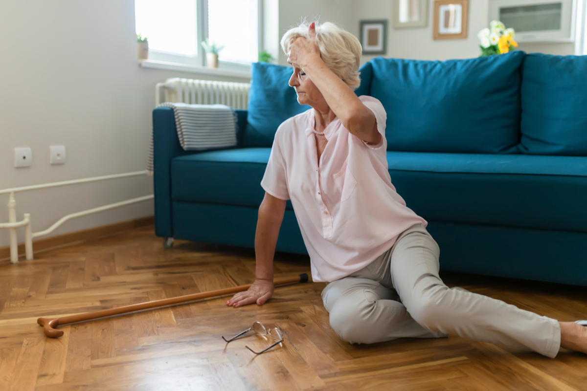 Woman sitting on floor after a fall 
