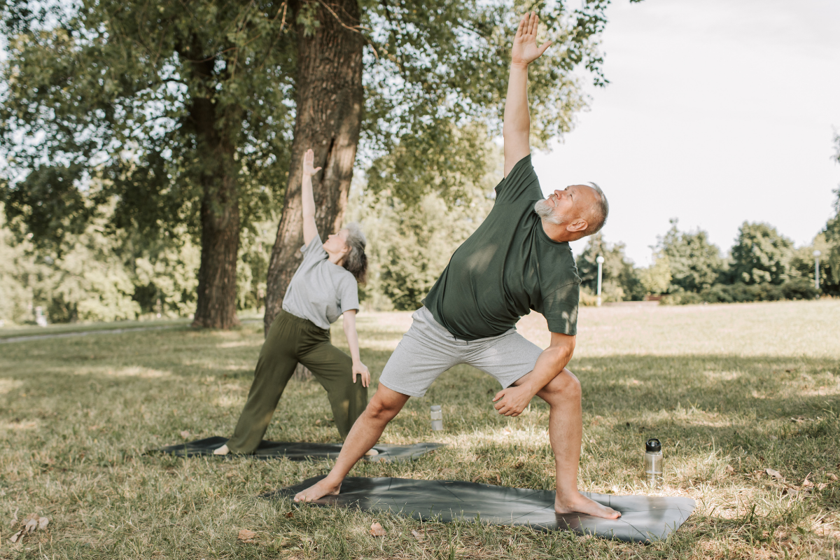 mature couple practicing yoga for natural sciatica treatment