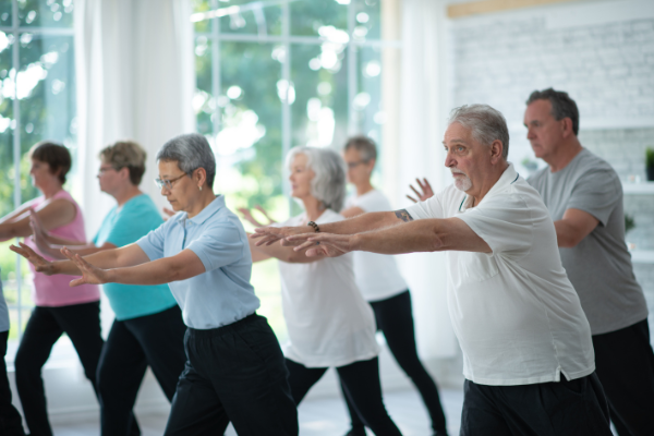 Group of older adults doing Tai Chi