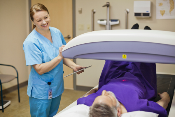 Senior man receiving a bone density scan