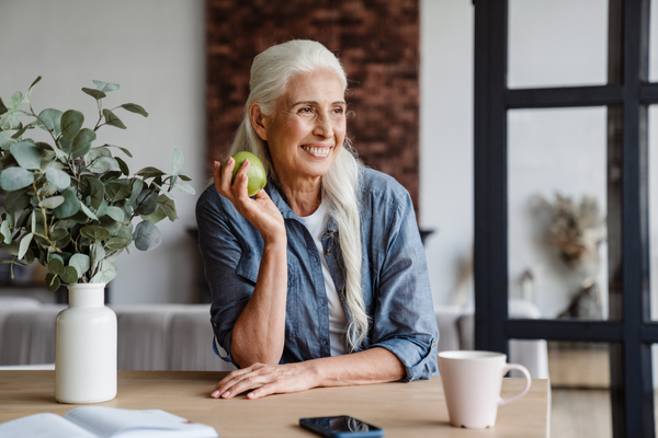 Woman exhibiting the benefits of stress management by being healthy and happy at an older age