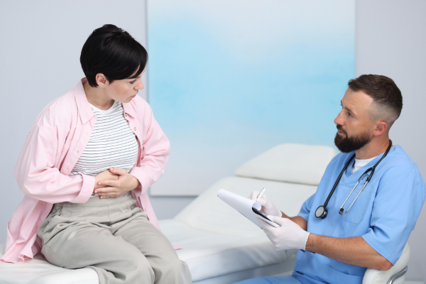 Woman discussing women's gut health issues with healthcare provider