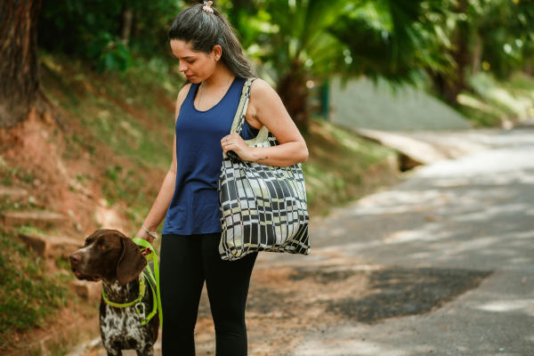 Woman staying active by taking her dog for a walk