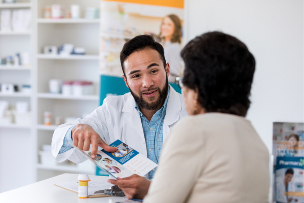 A pharmacist discussing medications with a patient