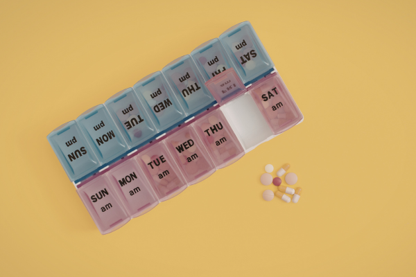 An image of a pill organizer with some of the pills removed