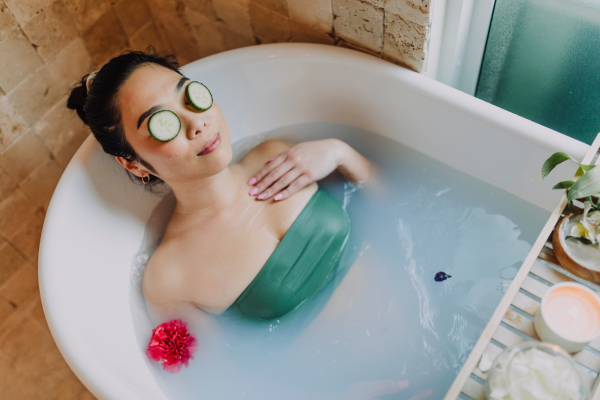 A woman taking a relaxing bath