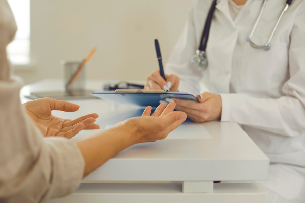 A person discussing symptoms with healthcare provider